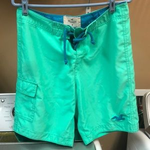 Hollister teal swim trunks with blue ties.